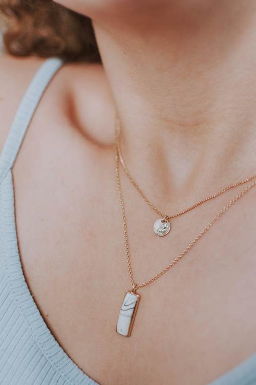 How to Style Sleek Chains for a Layered Look